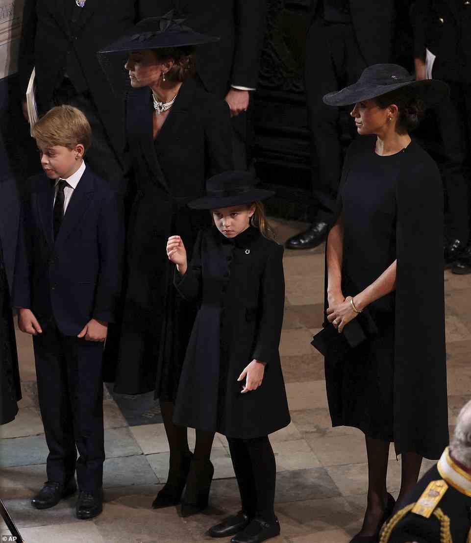 The Princess of Wales, Prince George and Princess Charlotte waited with the Duchess of Sussex to join the walk behind the coffin