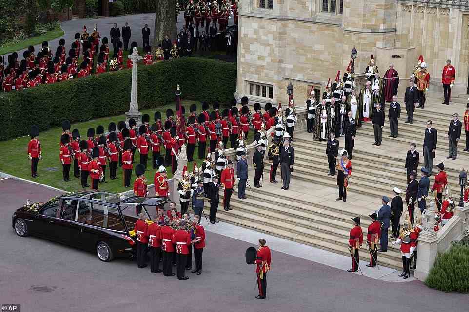 The coffin of Queen Elizabeth II is carried from the hearse
