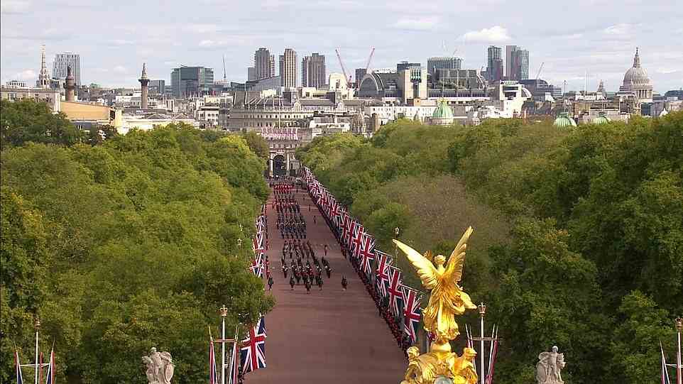 The procession marches along The Mall towards Buckingham Palace