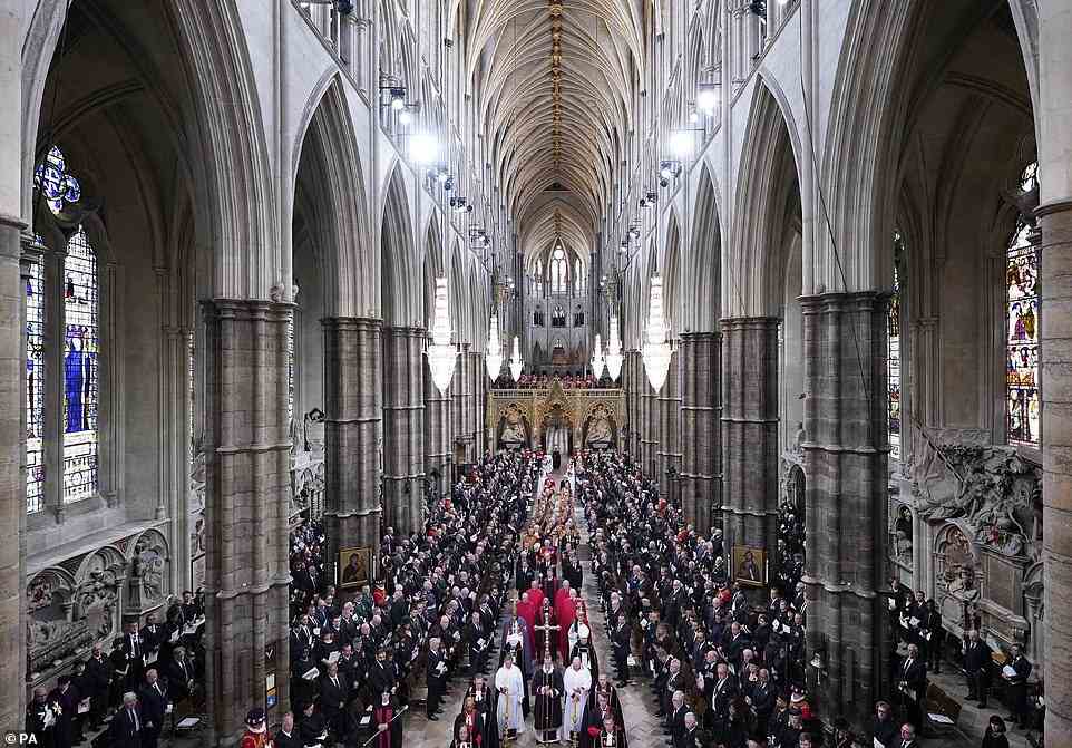 Members of the clergy wait for the coffin of Queen Elizabeth II to arrive at Westminster Abbey