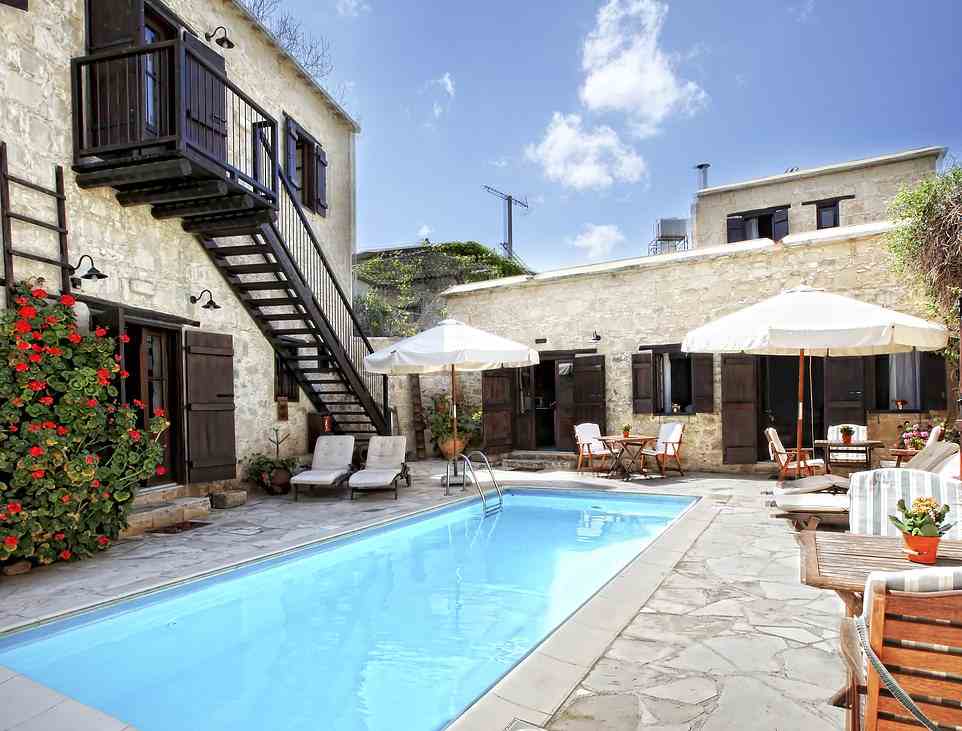 Simple charms: Olympic Holidays offers 28 nights from £17 a night at Leonidas Village (above) in Cyprus, which has self-catering apartments set around a pool