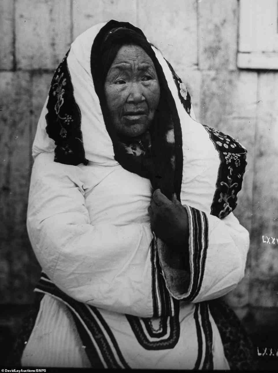 Pictured: An Inuit elder wraps up against the cold in Newfoundland and Labrador during the 19th century