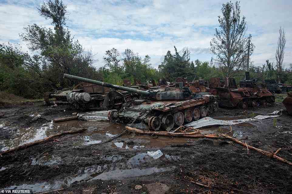 Putin lashed out at the free world after his military suffered a humiliating rout near Kharkiv last week that handed a swathe of territory back to Ukraine (pictured, destroyed Russian tanks)