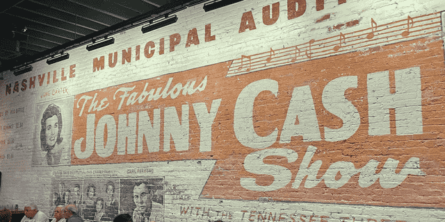 A mural inside Johnny Cash's Bar and BBQ in downtown Nashville promotes an early career performance by the legendary entertainer.