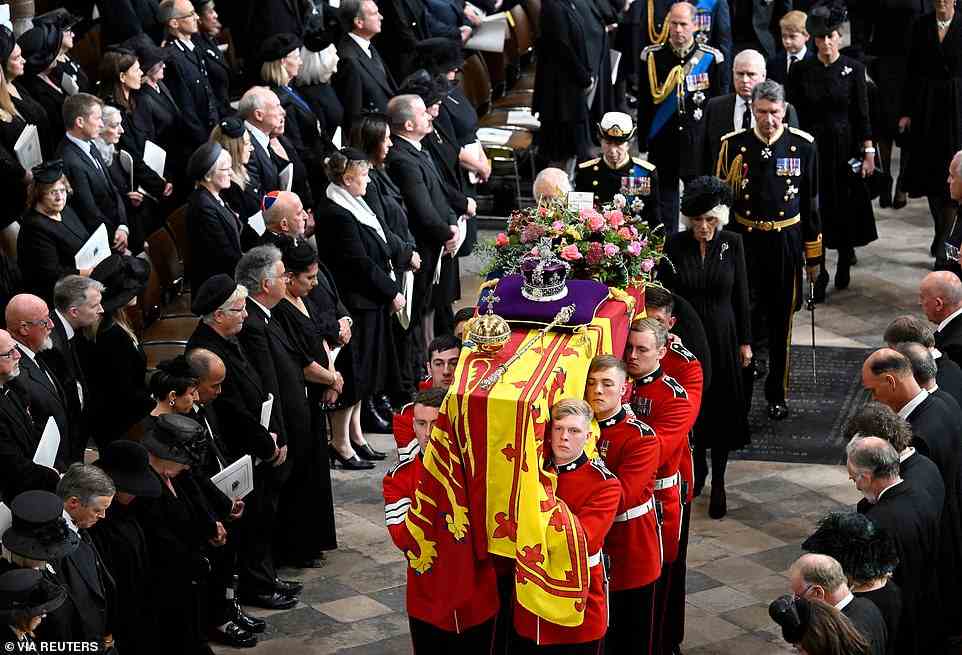 King Charles, Camilla, Queen Consort, Anne, Princess Royal, Vice Admiral Sir Timothy Laurence, Prince Andrew, Duke of York, Prince Edward, Earl of Wessex, Sophie, Countess of Wessex follow behind the coffin of Queen Elizabeth II with the Imperial State Crown resting on top of it carried by pallbearers as it departs Westminster Abbey