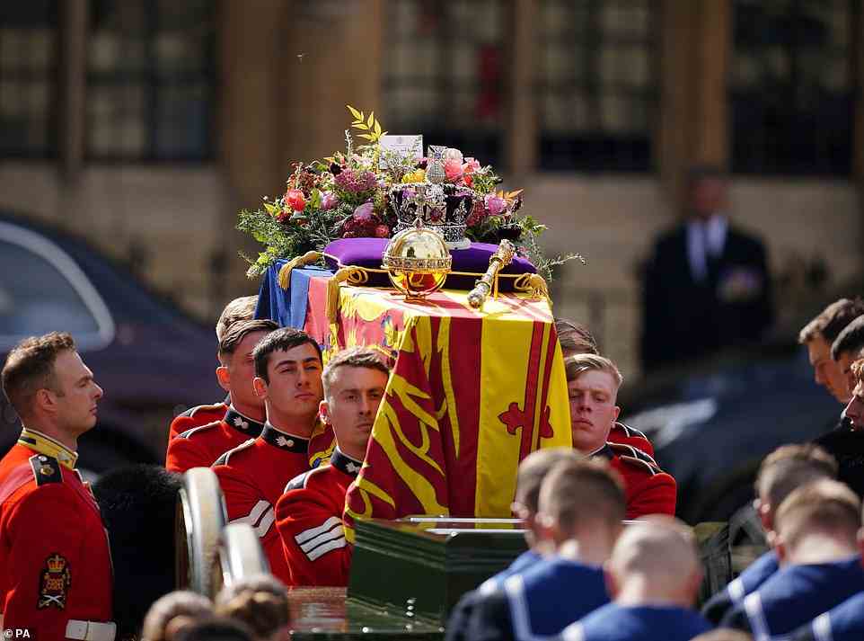 The coffin of Queen Elizabeth II being carried by the right pallbearers leaving the State Funeral held at Westminster Abbey