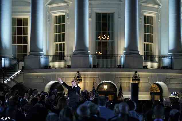 Elton John is seen with the White House as his backdrop on Friday night