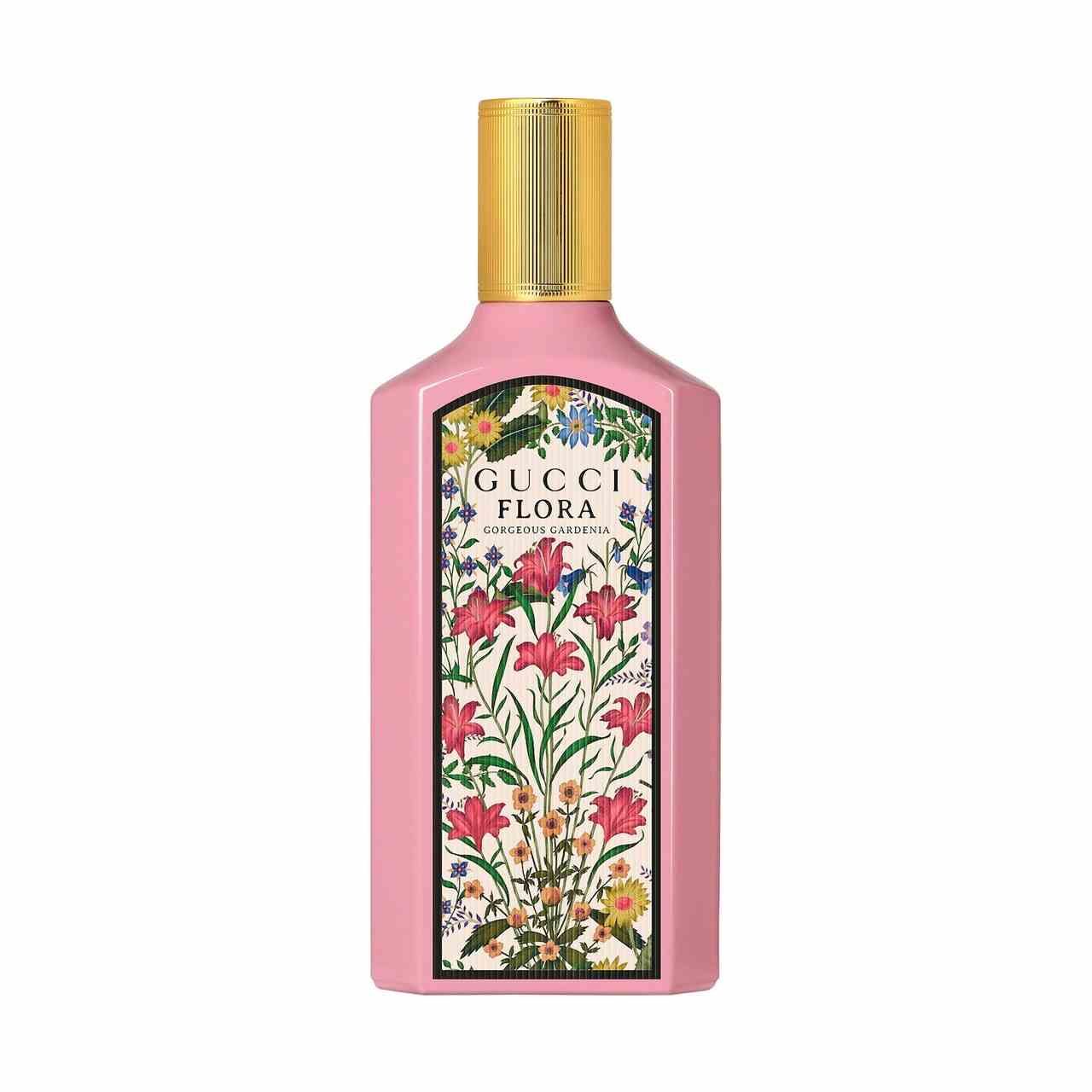 Gucci Flora Gorgeous Gardenia Eau de Parfum rosafarbene Parfümflasche mit floralem Panel und goldener Kappe auf weißem Hintergrund