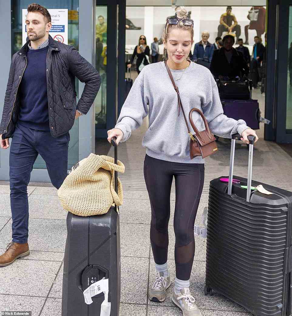 Filming: Corrie actress Helen, 32, looked comfortable in a light grey jumper as she stepped out with all her luggage
