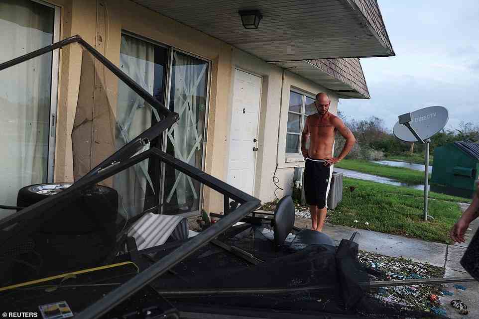Shawn Hulbert, 38, stands outside his damaged home in the aftermath of Hurricane Ian in Punta Gorda, Florida