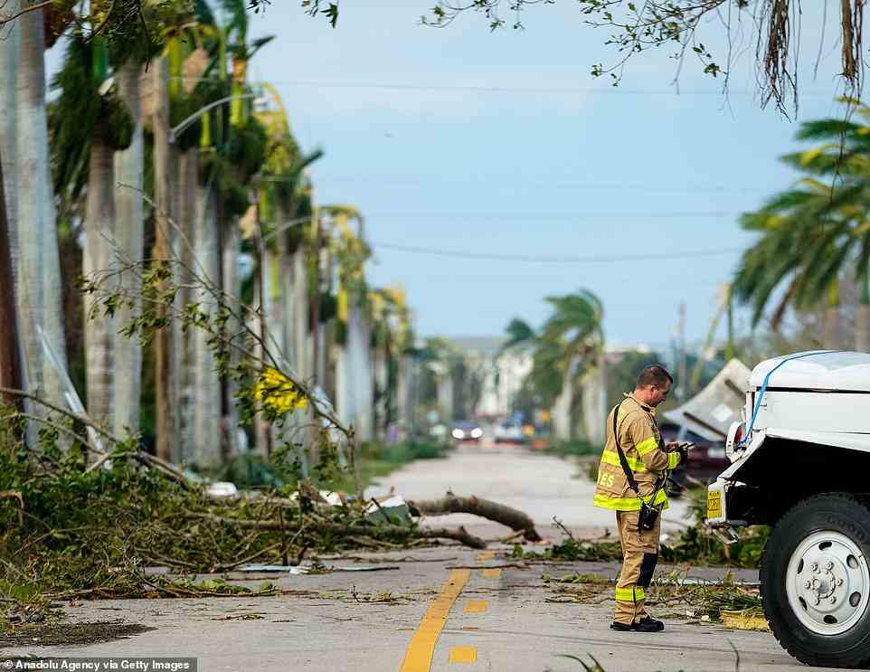 PUNTA GORDA: A firefighter stands by fallen trees aftermath of hurricane in Punta Gorda district, as Ian is intensifying to become a Cat 1 hurricane when it his South Carolina on Friday
