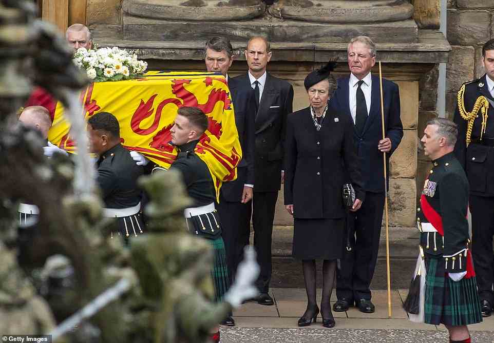 A daughter's grief: Princess Anne, 72, who is known to keep her feelings private, was visibly moved as she escorted the Queen's hearse to the Palace of Holyroodhouse in Edinburgh yesterday