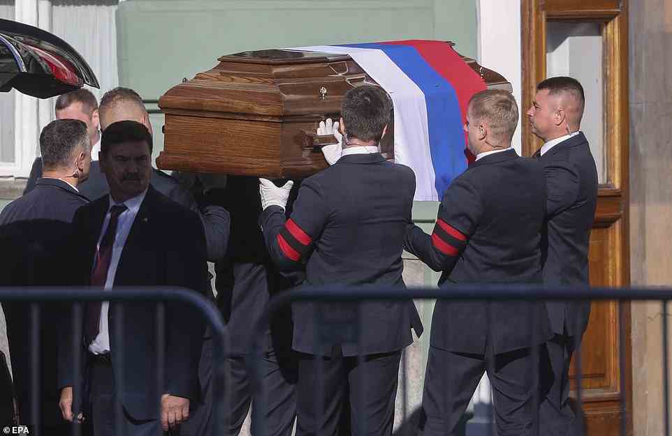 Mikhail Gorbachev will be laid to rest today in a Moscow ceremony, but without the fanfare of a state funeral and with the glaring absence of President Putin. Pictured: Employees transfer his coffin to Hall of Columns of the House of Trade Unions