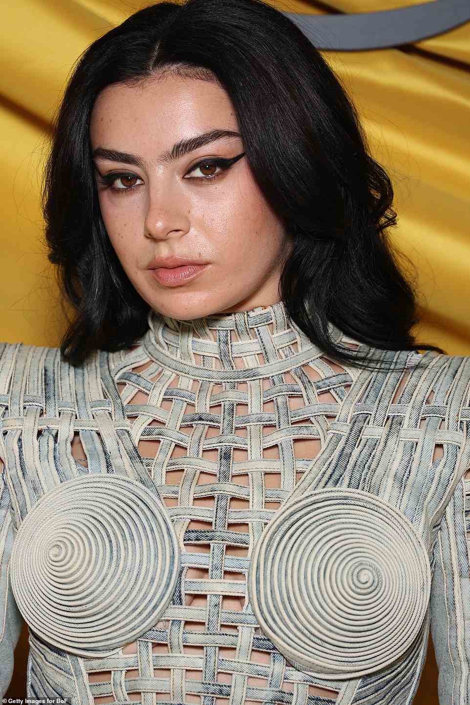 Makeup look: Charli added a winged eyeliner look, adding a subtle base to the rest of her complexion for the appearance