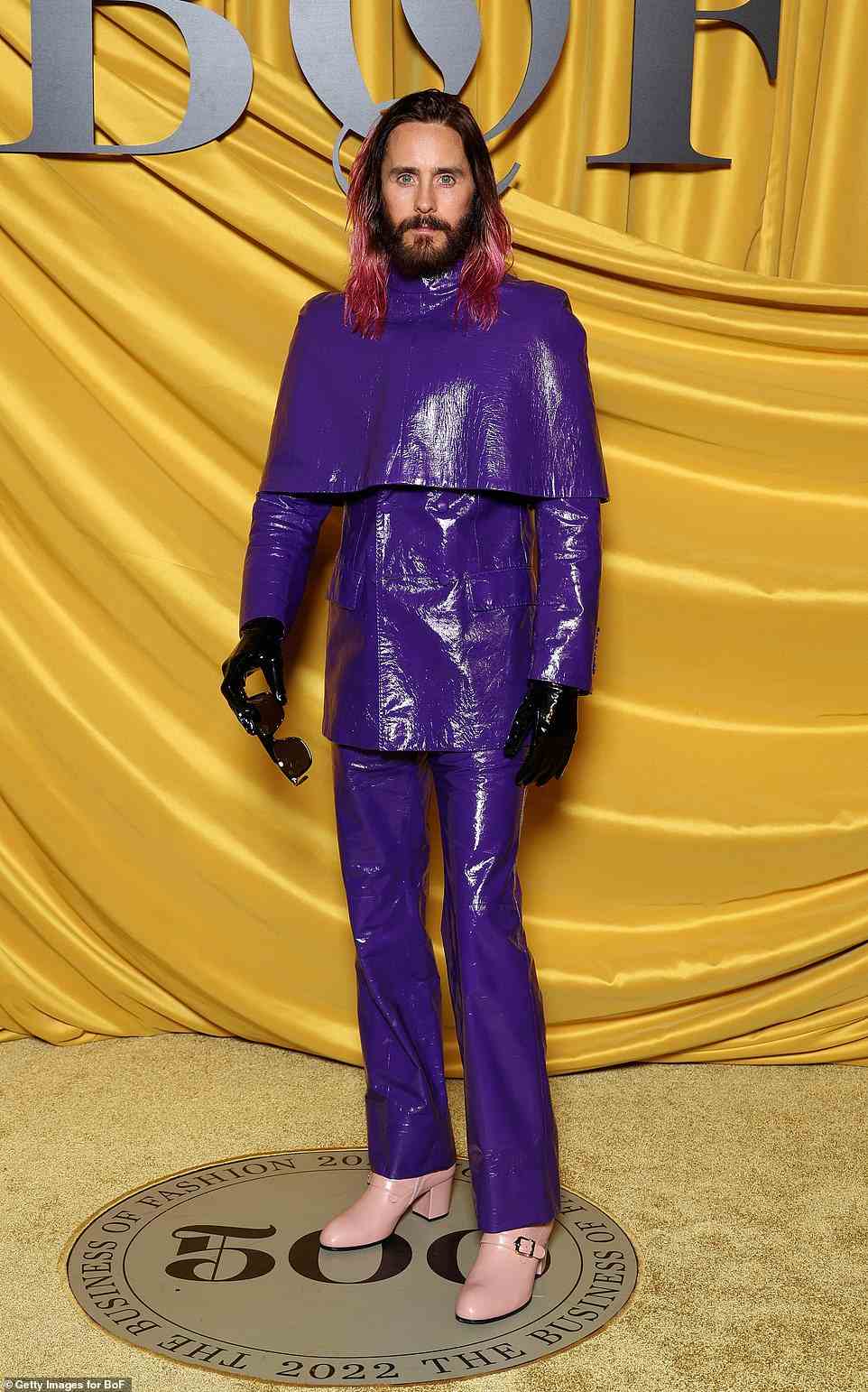 Stylish: Jared Leto turned heads in a head to toe purple leather look which he teamed with pink boots