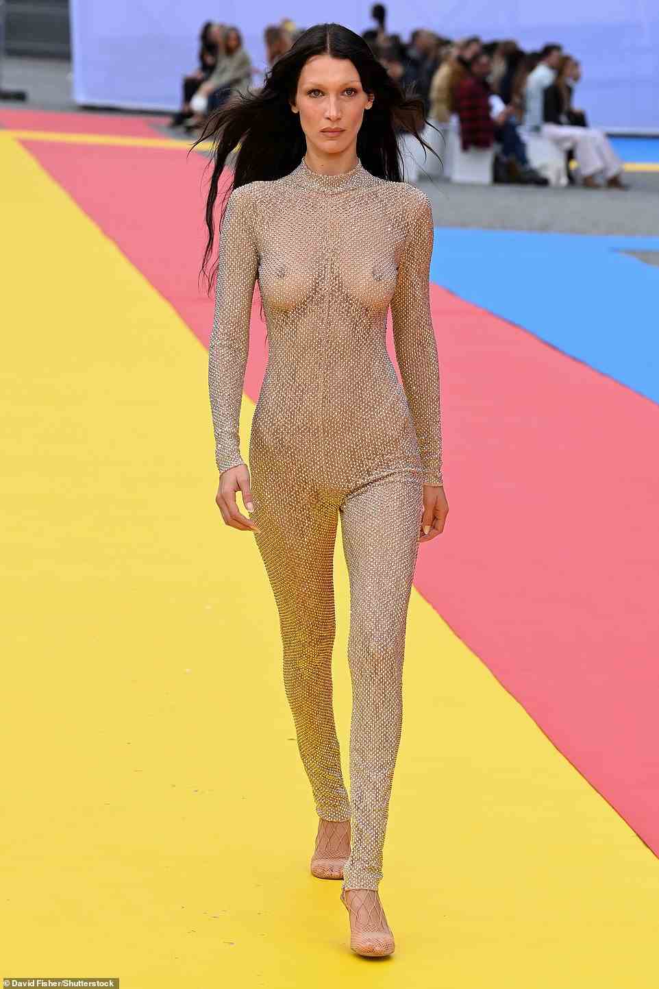 Eye-popping: Elsewhere, Bella Hadid certainly turned heads when she walked the runway for Stella McCartney, going braless under a sheer nude unitard which was covered in embellishments