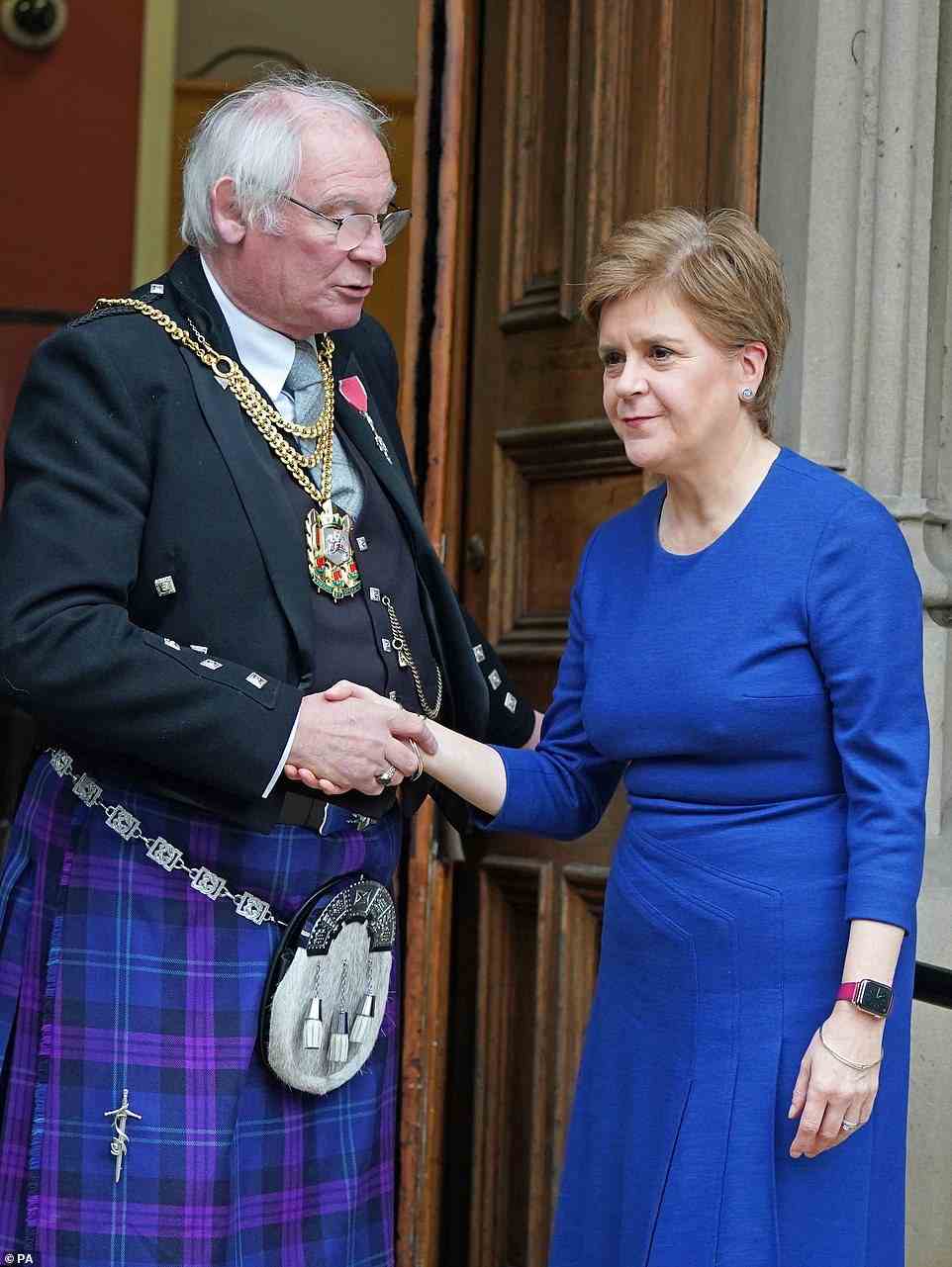 First Minister Nicola Sturgeon is greeted by Lord Provost of Dunfermline Jim Leishman as she arrives at the City Chambers in Dunfermline. There were cheers and boos