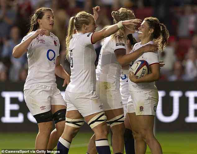 Transwomen rugby players have been banned from playing in female-only games in Britain over concerns of safety and fairness (England's Helena Rowland celebrates scoring her side's first try during the Womens Rugby International match between England Women and Wales last month)