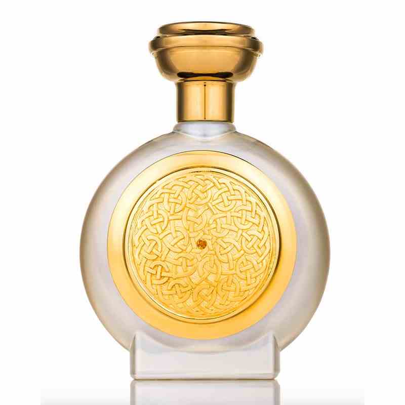 Eine goldene und klare Milchglas-Parfümflasche der Boadicea the Victorious Amber Sapphire Gold Collection Perfume auf weißem Hintergrund