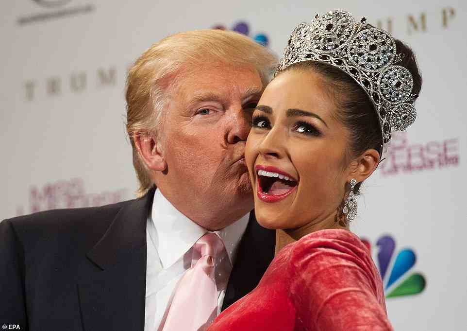 'I remember putting on my dress really quick. I was like, "Oh my God, there’s a man in here,"' one Miss Teen contestant told Buzzfeed, while another added, 'Some girls were topless. Others girls were naked.' Trump is seen with Miss Universe 2012