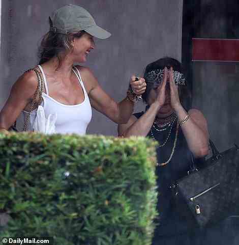 Gisele was even seen proudly flexing her biceps to her healer, who laughed as the model showed off her muscles