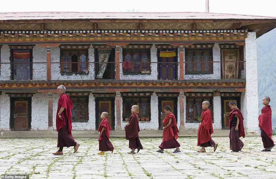 Ivo encounters 'reminders' of Bhutan’s Vajrayana Buddhist traditions 'everywhere' on his hike. Above are young monks at the country's Karchu Dratshang monastery