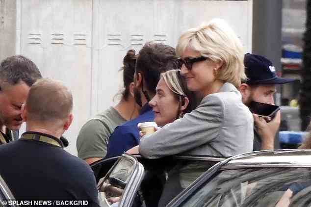 A cuddle onset! Debicki showed her appreciation for fellow crew members as she pulled a owman in for a hug from behind