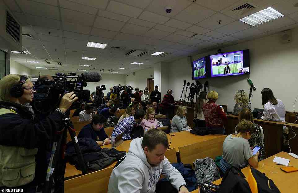 Journalists covering the appeal hearing for Brittney Griner are seen packed outside of a Moscow-area court room