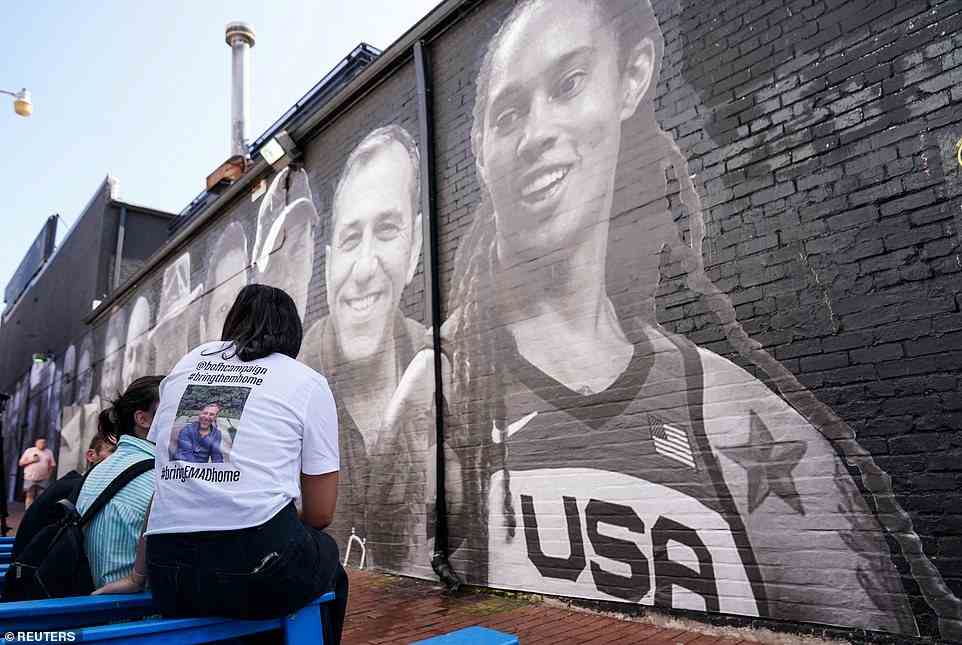People visit a mural of Brittney Griner and other hostages around the world created by the Bring Our Families Home Campaign, a campaign led by family members of Americans wrongfully detained or held hostage abroad, in the Georgetown neighborhood of Washington