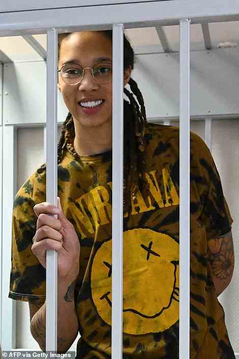 Griner smiles inside a defendants' cage during a hearing at the Khimki Court in the town of Khimki on July 15