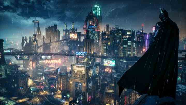 Batman mit Blick auf die Neonlichter von Gotham in Arkham Knight.