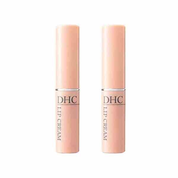 DHC Lippencreme (2er-Pack) zwei pfirsichfarbene Lippenbalsamröhrchen auf weißem Hintergrund