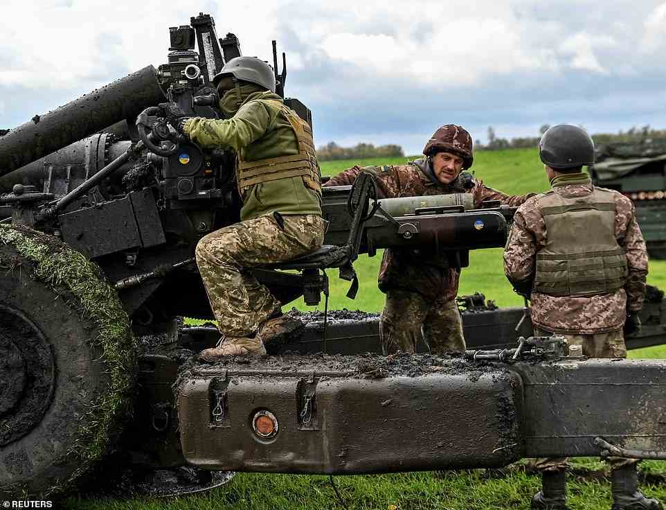 Ukrainian service members prepare to shoot from a towed howitzer FH-70 at a front line, as Russia's attack on Ukraine continues, in Zaporizhzhia Region, Ukraine