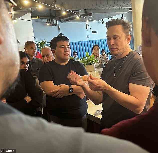Elon Musk speaks with employees including fired top counsel Vijaya Gadde (left) yesterday after taking over at Twitter. She was responsible for permanently banning President Trump from the site - a move that Musk says he will reverse