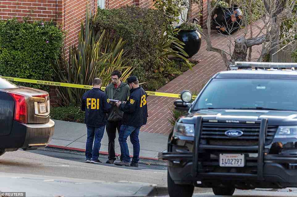 FBI agents work outside the home of House Speaker Nancy Pelosi where her husband Paul Pelosi was "violently assaulted" after a break-in at their house