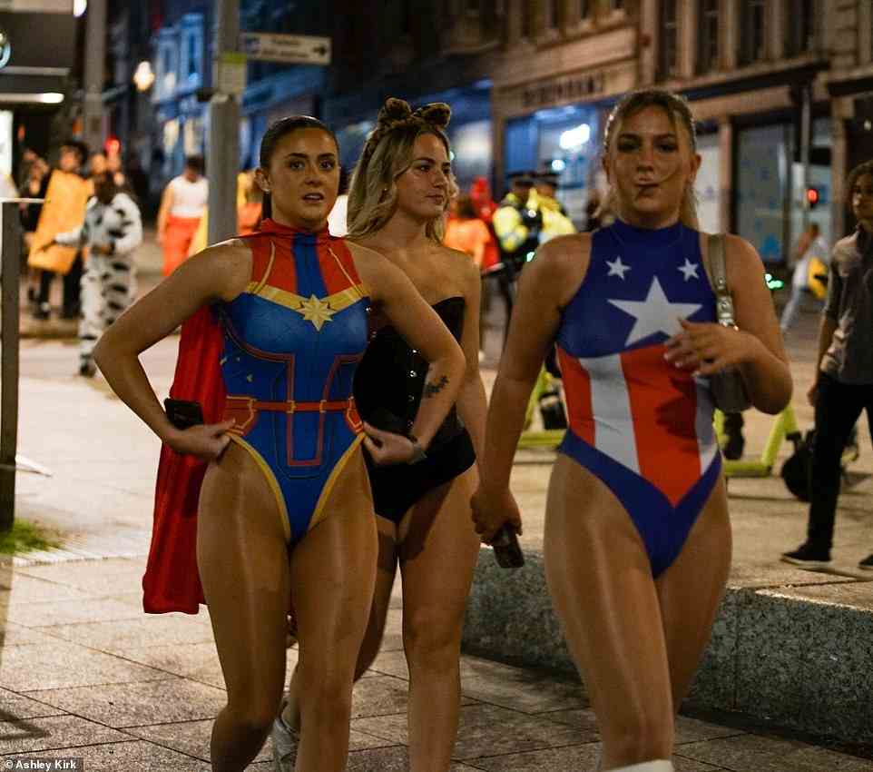 Women dressed as superheroes and a cat join the celebrations in Nottingham as the night out got underway yesterday