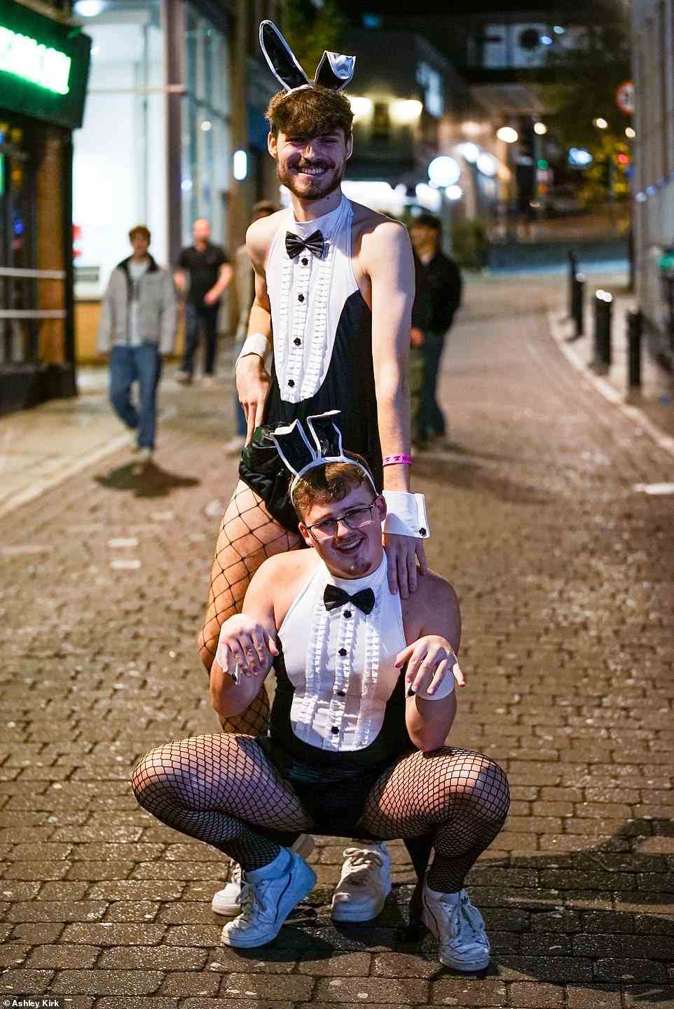 Two men wear a daring take on the Playboy bunny outfit in Nottingham city centre last night