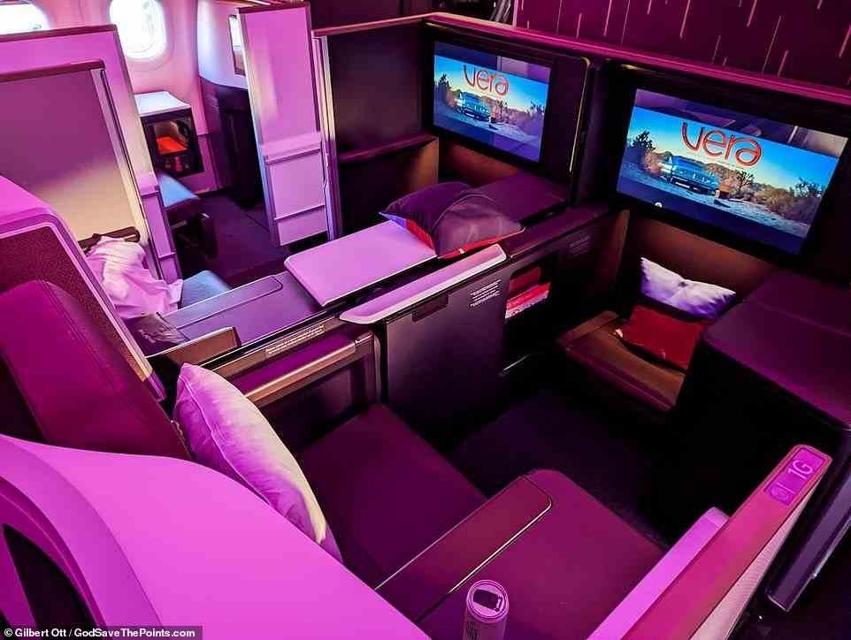 The front row of the A330neo business-class cabin features two 'Retreat Suites', pictured, with 'wildly spacious seats'. They can be configured to form a quad socialising area