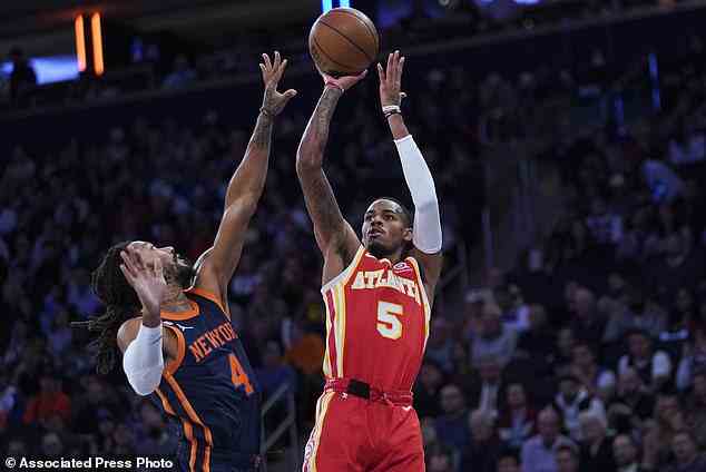 Atlanta Hawks guard Dejounte Murray (5) shoots as New York Knicks guard Derrick Rose (4) defends during the first half of the NBA game at Madison Square Garden