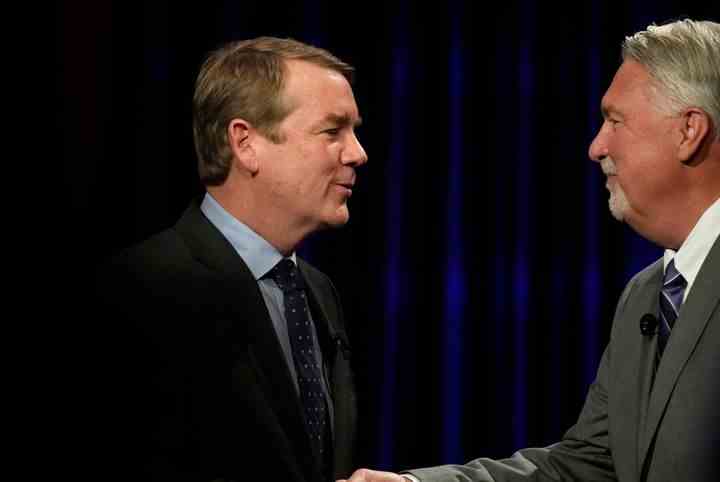 Bennet shakes hands with O'Dea at the conclusion of a televised debate on Oct. 28. O'Dea asked Bennet if he regretted voting for any spending bills in the past two years.