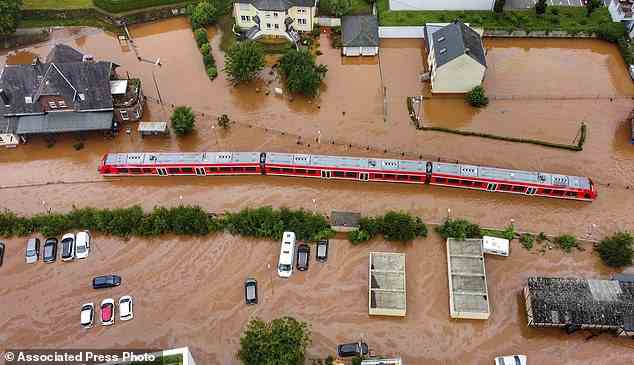 The IPCC assessment projected that the number of weather, climate and water-related disasters will increase in the future. Pictured: A train in the flood waters at the local station in Kordel, Germany on July 15 2021, after it was flooded by the high waters of the Kyll river