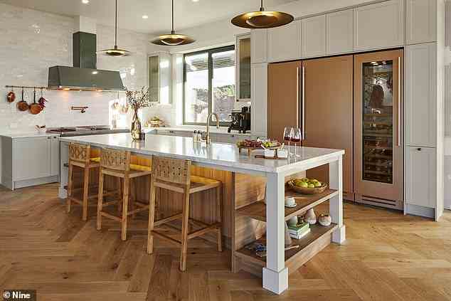 The pair's kitchen is pictured, with it's muted tones