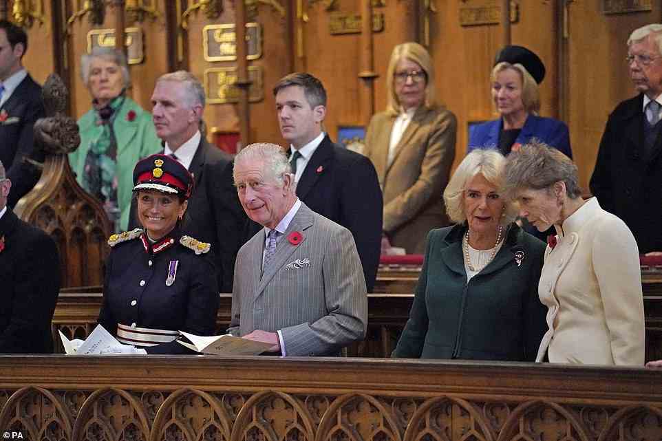 King Charles and Queen Consort Camilla chat to members of the congregation during a service to unveil a statue of Queen Elizabeth II