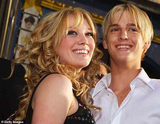 Complicated:  Aaron previously said he started dating Hilary on his 13th birthday (December 7 2000), adding: 'I was dating her for like a year-and-a-half, then I just got a little bored so I went and I started getting to know Lindsay [Lohan] (pictured 2003)