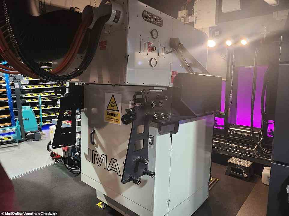 In the cinema's projection room, the new laser projector sits alongside the old IMAX 70mm film projector (pictured), still used for screenings of blockbuster films