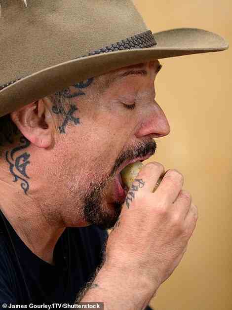 Iron stomach: Boy George looked as if he may have run into trouble as he struggled to swallow down the vile-tasting food