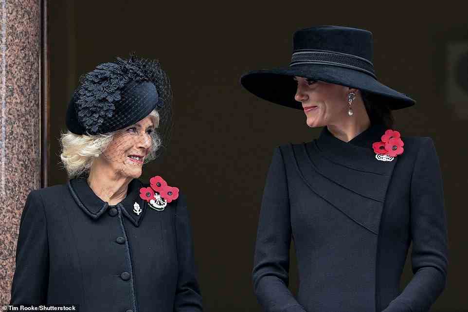 At one point, the Queen Consort (left) and the Princess of Wales (right) were seen smiling at each other as they exchanged a word from their vantage point on the balcony