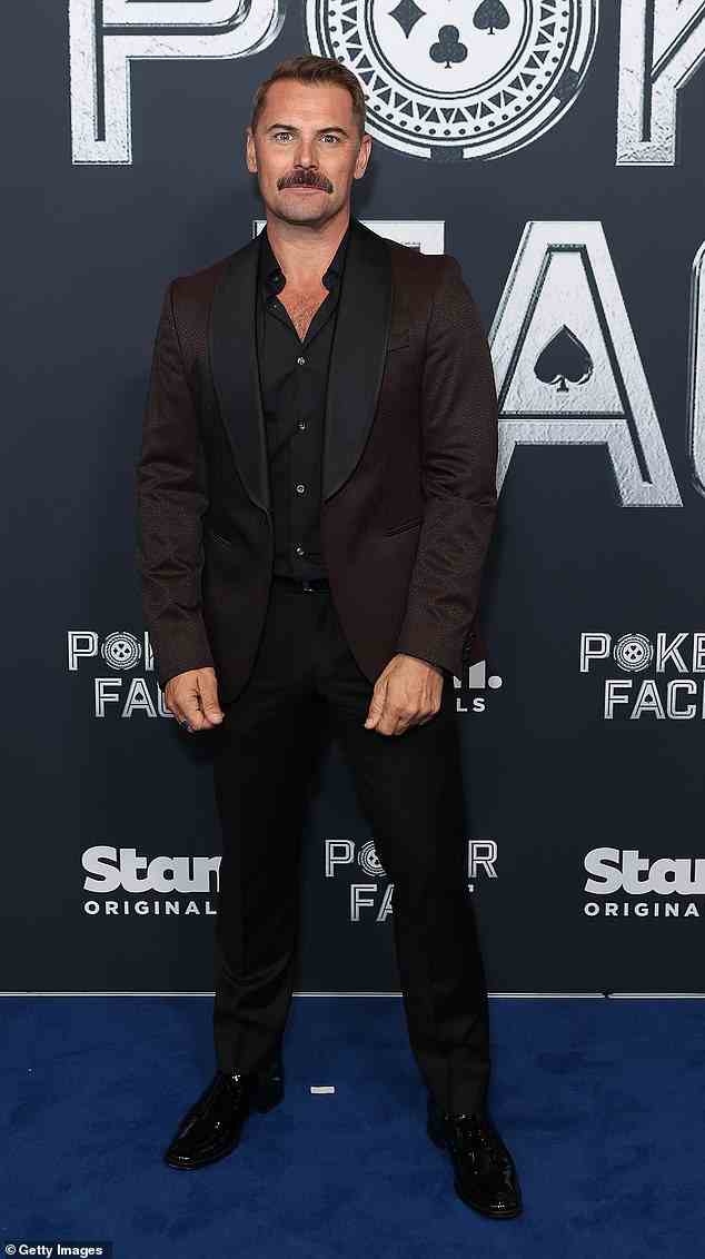 Dan MacPherson (pictured) looked chic in a black shirt and matching pants on the night