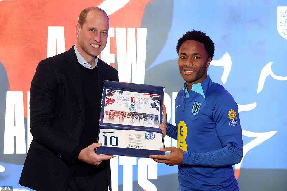 The Prince of Wales presents an England shirt to Raheem Sterling