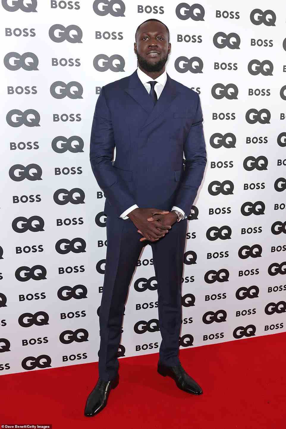 Smart: Stormzy cut a dapper figure as he attended the GQ Men of the Year Awards at the Mandarin Oriental Hyde Park Hotel in London on Wednesday